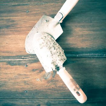 shovel on wood background vintage style