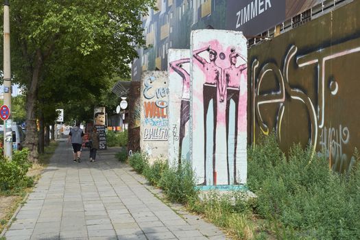 BERLIN, GERMANY - JULY 07: Segments of Berlin Wall in East Berlin filled with grafitti art. July 07, 2015 in Berlin.