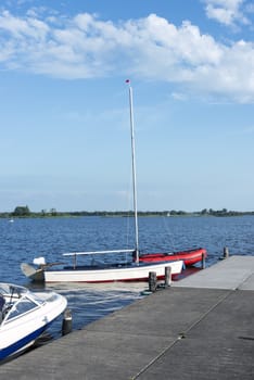 The belderwiede lake in holland with sailing boats on the quay