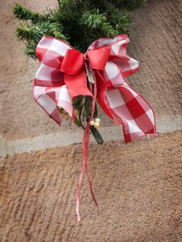 Image of a red white bow of ribbon as decoration on a Christmas market