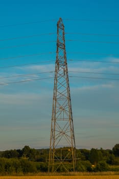 side view of electricity pylon in rural setting