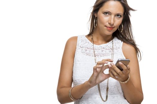 Vivacious attractive woman reacting to a text message on her mobile phone flicking her hair in the air and staring at the phone with her mouth open, on white with copyspace