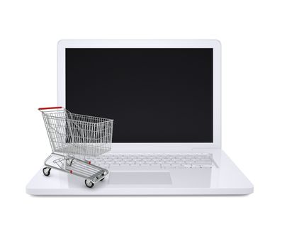 Shopping cart on white laptop on isolated white background