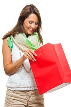 Close up Smiling Fashionable Woman Looking Inside a Red Shopping Paper Bag. Isolated on White Background.