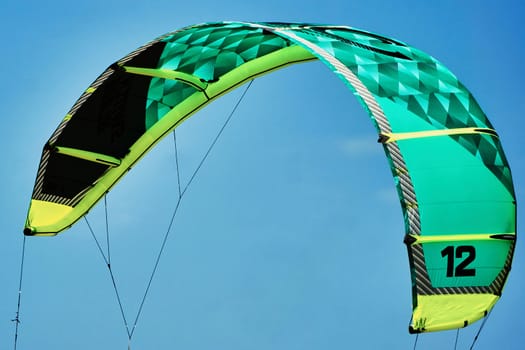 Kite surfing against the blue sky
