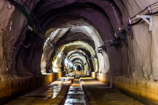 cave tunnel mine long walk way with light 