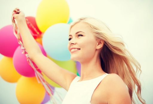 summer holidays, celebration and lifestyle concept - beautiful woman with colorful balloons outside