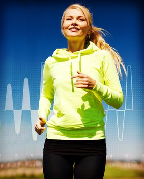 fitness, sport, training and lifestyle concept - smiling female runner jogging outdoors