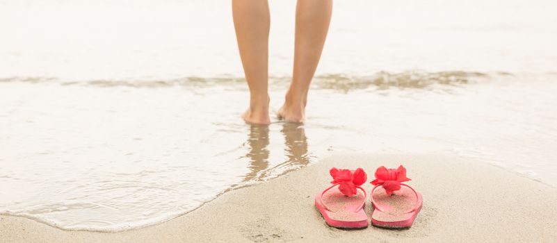 Woman paddling in the sea at the beach