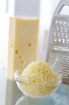 piece of cheese and grated cheese