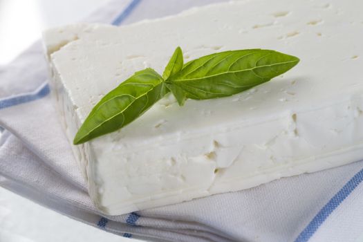 Traditional Greek feta cheese with basil