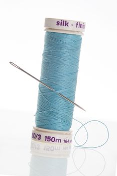 Blue thread with needle