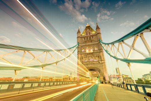 Bus light trails across Tower Bridge, London.