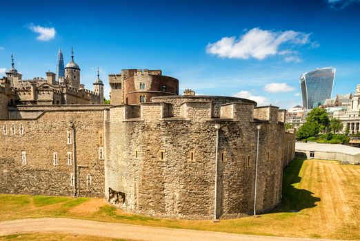 Tower of London ancient complex with City on background.