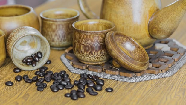 Soft focus image of coffee beans and coffee cups set on wooden background.Vintage style.(soft focus)