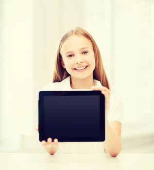 education, school, technology and internet concept - little student girl with tablet pc at school