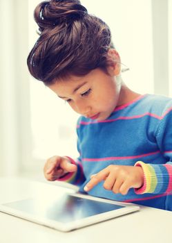 education, technology and internet concept - little girl with tablet pc