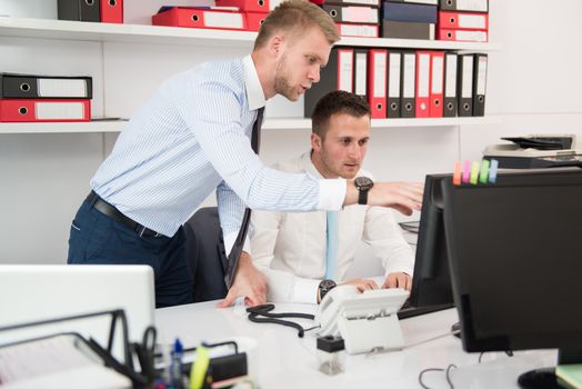 Happy Young Business Men Work In Modern Office On Computer