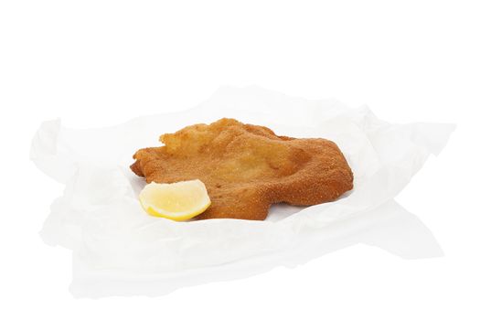 Delicious wiener schnitzel on baking paper isolated on white background. Fresh modern image language. Culinary arts.