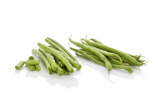 Fresh green beans with water drops isolated on white background. Healthy eating. 