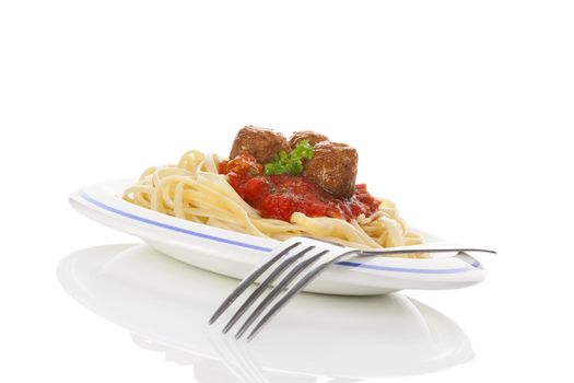 Pasta with tomato sauce and meatballs. Traditional mediterranean eating. 