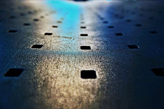 Abstract look of metal bench with blue night light