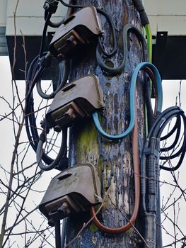 Wooden Electricity Pole with high voltage cables and Junction Boxes