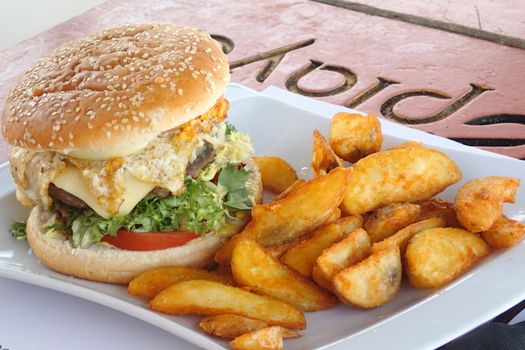 Burger with potato wedges