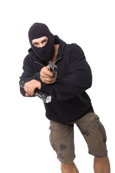 Man in black mask and black cloth holding flashlight and gun isolated on white background. Dangerous criminal committing crime.