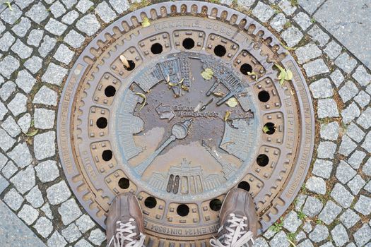 BERLIN, GERMANY - JULY 08: Berlin manhole cover design depicting TC tower and other landmarks. July 08, 2015 in Berlin.