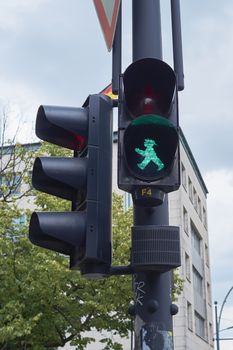 BERLIN, GERMANY - JULY 08: Detail of pedestrian traffic light showing emblematic Berlin green man. July 08, 2015 in Berlin.