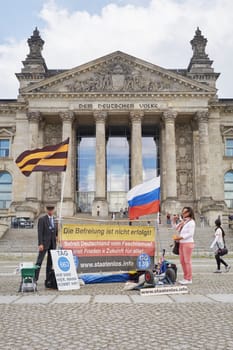 BERLIN, GERMANY - JULY 08: Protesters in front of Reichstag building. July 08, 2015 in Berlin.