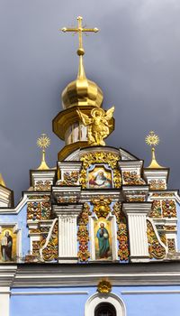 Saint Michael Monastery Cathedral Steeple Spire Facade Kiev Ukraine.  Saint Michael's is a functioning Greek Orthordox Monasatery in Kiev.  The original monastery was created in the 1100s but was destroyed by the Soviet Union in the 1930s.  St. Michaels was reconstructed after Ukrainian independencein 1991 and reopened in 1999.