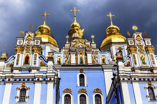 Saint Michael Monastery Cathedral Steeples Spires Facade Kiev Ukraine.  Saint Michael's is a functioning Greek Orthordox Monasatery in Kiev.  The original monastery was created in the 1100s but was destroyed by the Soviet Union in the 1930s.  St. Michaels was reconstructed after Ukrainian independencein 1991 and reopened in 1999.