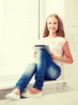 education, school, technology and internet concept - little student girl with tablet pc at school