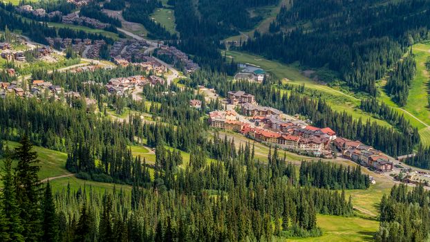 View of Sun Peaks Village, a popular ski resort in central British Columbia, as seen from the chairlift in summer