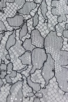 Close up photo of a lacy tablecloth