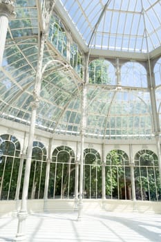 The Crystal Palace is located in the heart of the buen retiro park in Madrid in front of a lake