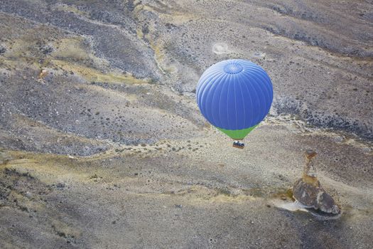Air balloon flying above the land. Horizontal photo