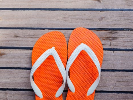 Flip flops on sailing yacht floor for summer background .