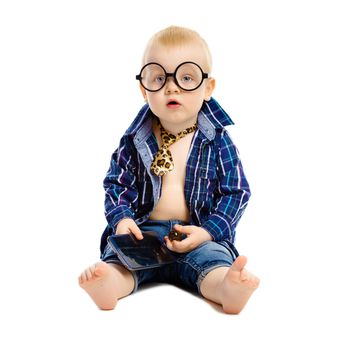A little boy in a tie and glasses on a white background