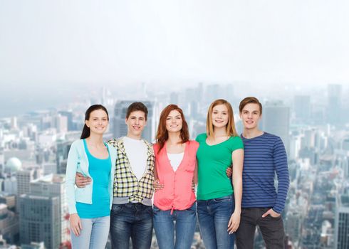 education and people concept - group of smiling students standing