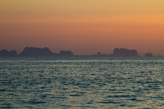 At the beach in thailand in summer at sunset, view on the sea