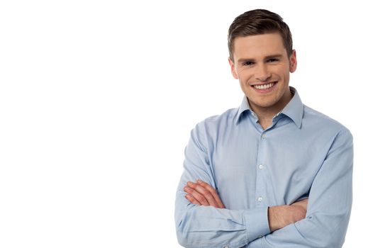 Confident young man looking at camera over white