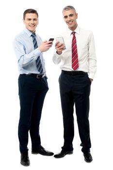 Happy male executives posing with cell phone