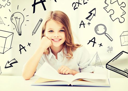 education and school concept - little student girl studying at school