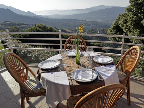 table ready for dinner, in corsica with view on valley