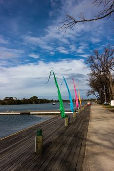 A launching ramp at Albert Park, home of the Australian Formula 1 Championship. Colourful flags in midground.