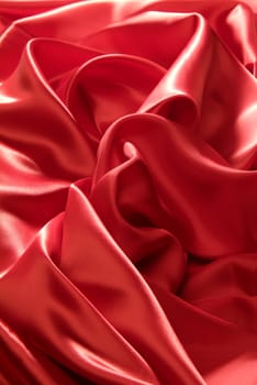 Sinuous draping red silk for background