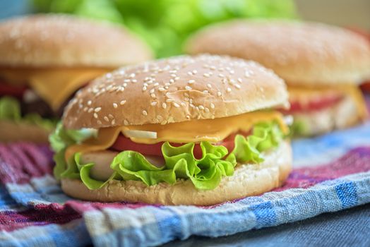 Closeup of home made burgers on wooden table